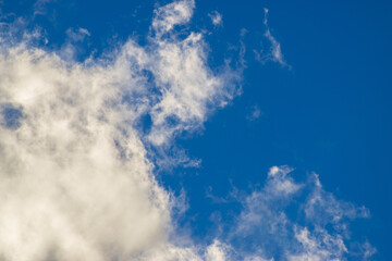 Fototapeta premium Beautiful blue sky with white fluffy clouds, natural daytime image, cloudscape with copy space. Scenic beauty of nature of Leh, Ladakh, India. Ladakh is known for clear atmosphere, bright environment.