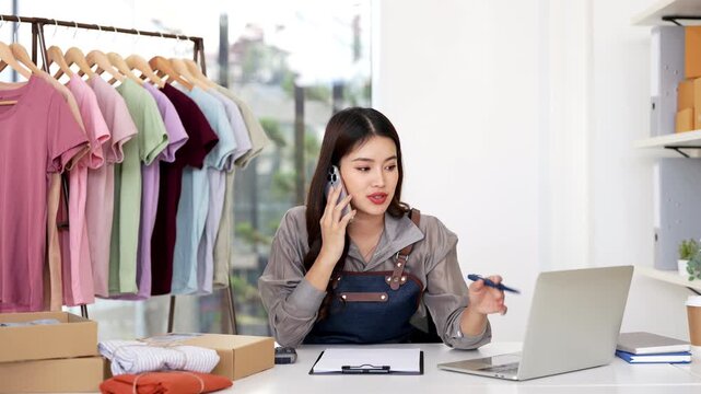 Asian girl shop online using phone call to client . Female small business owner delivering parcel box. Internet shopping lifestyle, Ecommerce shipment service, SME sale promotion advertise concept