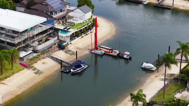 Aerial View of Piling Rig and Waterfront Homes in Gold Coast
