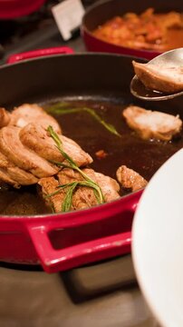 Sliced Roast Chicken Served from Red Pot at Hotel Buffet