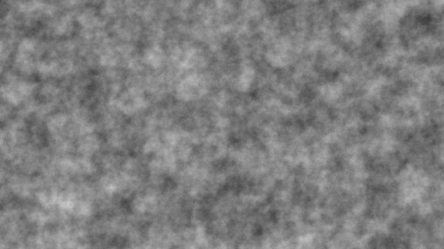 Abstract grayscale texture with slow moving smoke clouds creating hypnotic visual background effect.