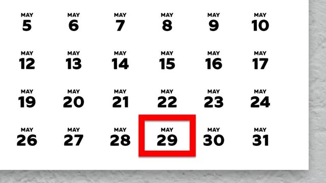 The date May 29th marked with a red cursor on the wall calendar 2026