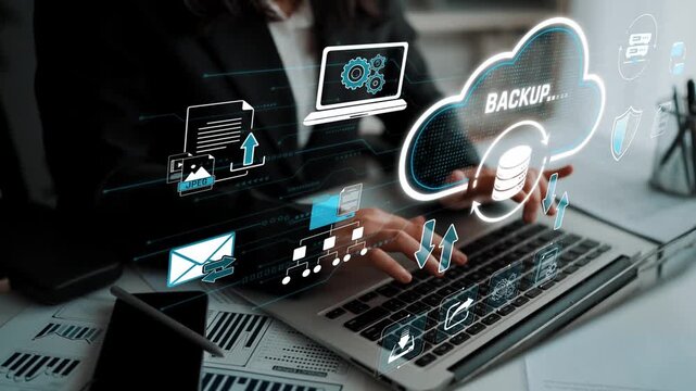 Modern Digital Backup Solutions in Business Environment with Hands Typing on Laptop Surrounded by Cloud Graphics and Data Icons Sigmoid