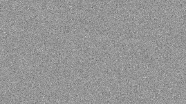 Static noise texture overlaying gray background with grain effect creating retro television sensation.