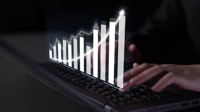 A close-up image of hands typing on a laptop keyboard, with an abstract graph overlay showing financial growth and data analysis in a dark environment. Copula
