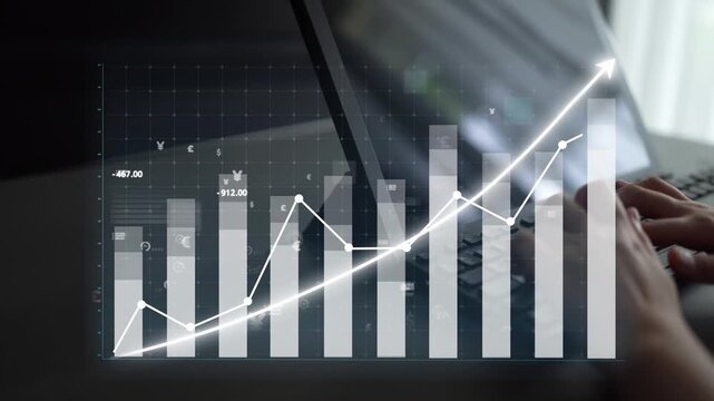 A close-up view of hands typing on a laptop, with a rising graph on the screen showcasing financial data and currency symbols, symbolizing growth and analysis in business. Copula