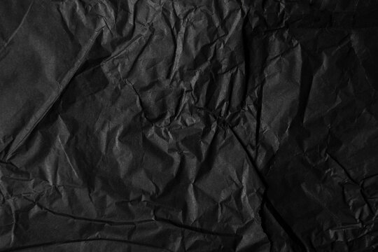Thin black wrap paper texture background 