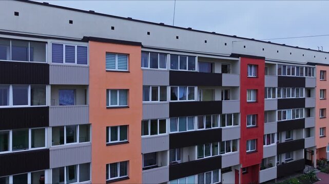 Drone rises from renovated Khrushchyovka revealing southwestern district