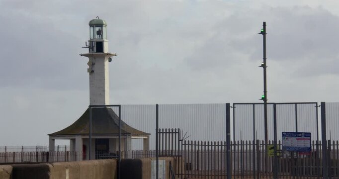 Wide shot of the entry lighthouse at South pier Lowestoft,