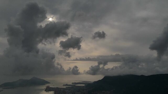 Dramatic Moonlit Clouds Over Coastal Landscape at Twilight