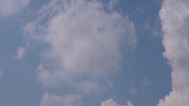 Soft Clouds Drifting Across Blue Sky