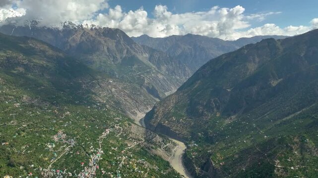 Kinnaur Kailash mountain range drone view from Kalpa village India
Aerial view of Kinnaur Kailash peaks near Kalpa village Himachal Pradesh
Drone shot of Kalpa village with Kinnaur Kailash mountains b