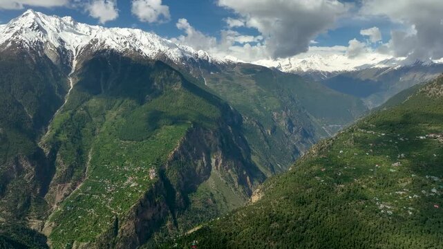 Kinnaur Kailash mountain range drone view from Kalpa village India
Aerial view of Kinnaur Kailash peaks near Kalpa village Himachal Pradesh
Drone shot of Kalpa village with Kinnaur Kailash mountains b
