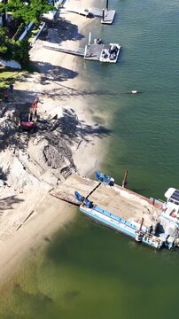 Aerial View of Beach Nourishment Dredging Barge and Excavator in Gold Coast