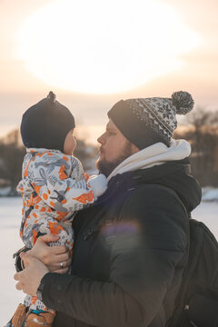 Father and Baby in Winter Landscape Copy Space