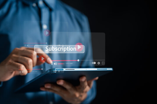 Video streaming subscription and premium media entertainment solution. Man using tablet to play movie and access online content.
