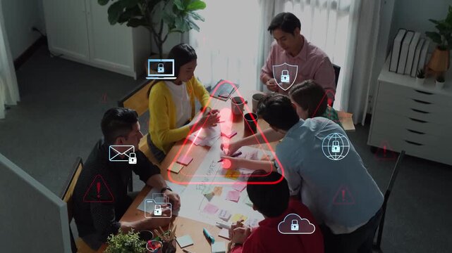 A diverse team collaborates in a modern office setting, surrounded by digital security alerts, highlighting the importance of risk management and data protection in their discussions. Raster