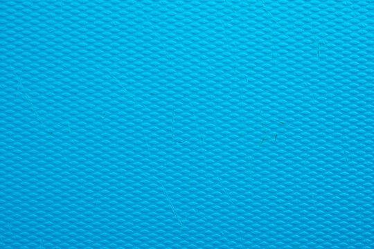 Turquoise blue textured surface with diamond embossed pattern and industrial plastic material