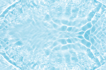 Blue water with ripples on the surface. Defocus blurred transparent blue colored clear calm water...