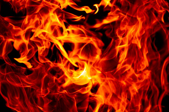 Flame abstract burning texture. Flame sparks with glowing light. Flame fire effect on black. Flame overlay background.
