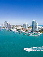 Fototapeta premium Miami seaside with turquoise ocean and sky. Miami city. Famous oceanfront of Miami. Miami Beach skyline.