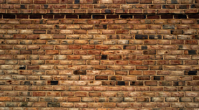 Brick wall made with bricks. Old red brick wall, masonry wall, stonework. Bric kwall background texture. Textured background of brickwall. Clinker brick.