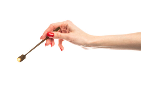 Coffee spoon in hand on white background