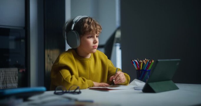 Boy Concentrating With Tools At His Desk. Young Boy Immersing Himself In Studying In Cozy Room