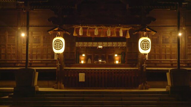Yohashira Shrine In Matsumoto, Japan, With Traditional Facade Illuminated At Night. close-up shot