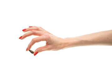 Fototapeta premium Female hand sunflower seeds on a white background isolation