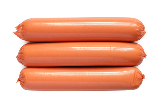 Three sausages on a white background. Thin long sausages close-up.