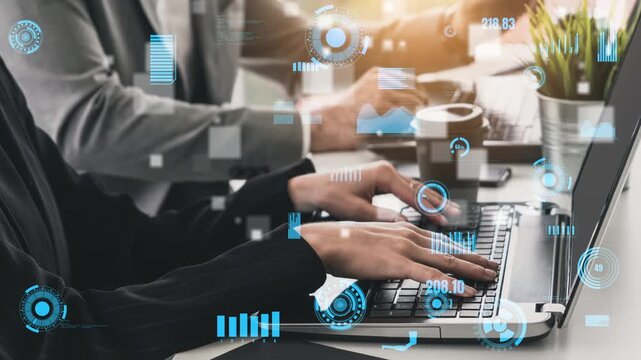 A professional team collaborates in a modern office, engaging in data analysis with laptops. Digital technology and interactive graphs enhance their productivity and teamwork. Xenic
