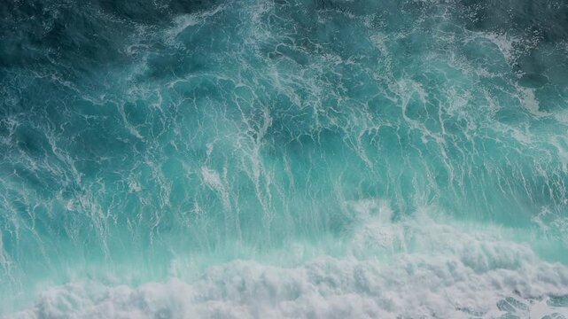 Blue oceanic crashing waves. Beautiful textures of tropical sea water