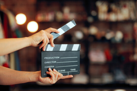 Professional Movie Slate ready for indoor Cinema Production. Film making equipment prepared on location for an upcoming motion picture scene inside studio