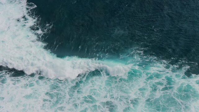 Blue oceanic crashing waves. Beautiful textures of tropical sea water