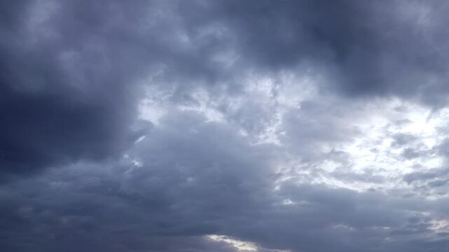 Dark Storm Clouds Gathering Over Open Landscape as Heavy Rain Begins