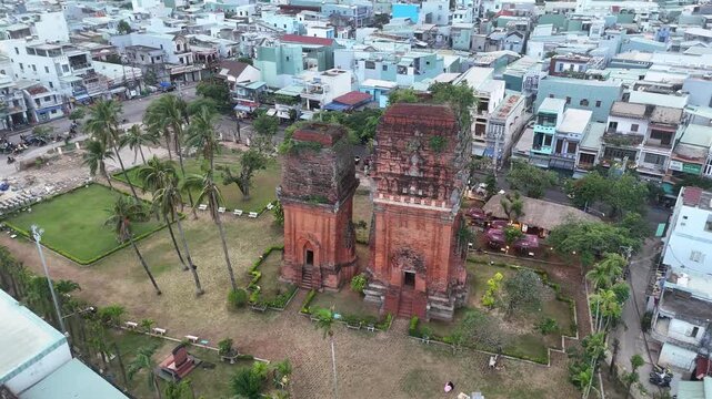 Historical Cham Towers Thap Doi in Quy Nhon Vietnam, ancient temple architecture, aerial cityscape, cultural heritage site