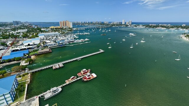 Aerial view of Peanut Island and the Lake Worth Lagoon with numerous boats and yachts docked at the marina in Palm Beach County, Florida, United States.