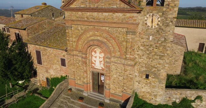 Old Medieval Church Of Santa Maria Assunta In The Village Of Panzano In Chianti, Tuscany, Italy. Aerial Rotate Shot
