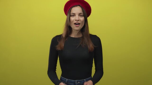 Woman with mouth open speaking in studio with chartreuse backdrop and red beret; surprised curiosity.