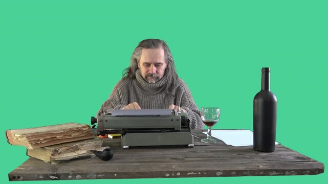 Mature writer with long gray hair sitting at vintage desk using typewriter and gesturing thoughtfully isolated on chroma key background