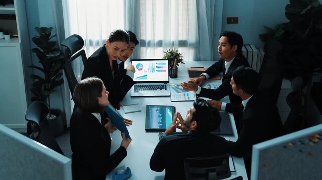 Top view of skilled analytic analysis stock market investment data at meeting. Businessman show increasing graph or financial statistic to investors at table with document and device. Directorate.