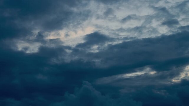 Dramatic dark storm clouds moving at dusk