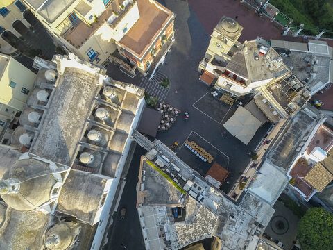 Aerial view of the historic Piazzetta and Santo Stefano church with its distinctive white domes and clock tower in Capri, Campania, Italy.