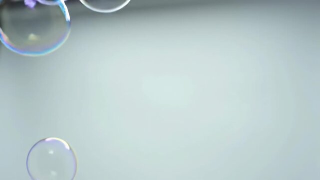 Three crystal clear, iridescent soap bubbles drift and ascend across a pristine pure white studio background with smooth bokeh. Concept of clarity, growth, innovation
