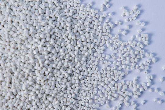 Polypropylene granule close-up background texture. plastic resin ( Masterbatch).Grey chemical granules for industrial plastic production