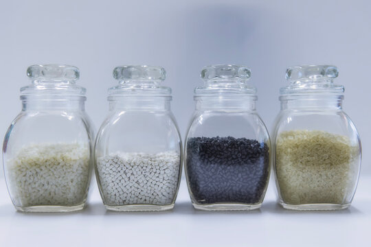 Polypropylene granule close-up background texture. plastic resin ( Masterbatch).Grey chemical granules for industrial plastic production