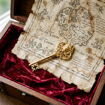 Golden Key Resting On Velvet Lined Treasure Map Antique Aged Surface Luxury Still Life Decor