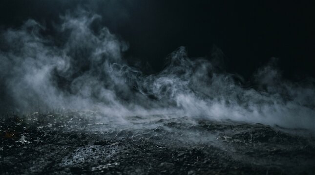 Low angle shot of dense ground fog and smoke on dark earth. Atmospheric mysterious mist for cinematic background or horror scene. Realistic vapor texture on black.