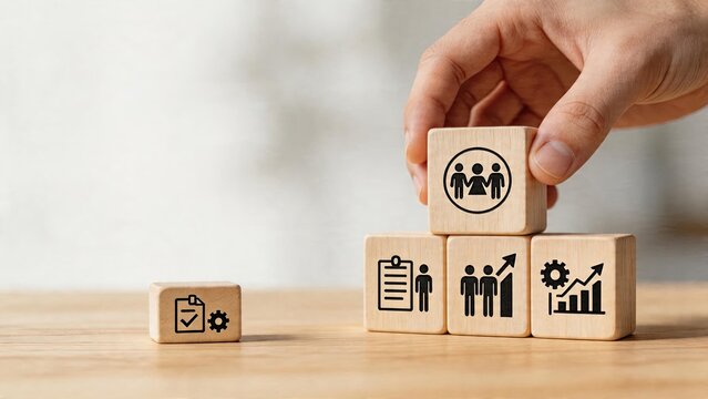 Business team building concept wooden blocks with icons of human resources growth strategy planning management organizational development corporate structure recruitment process